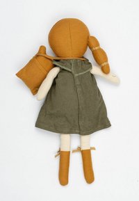 Handmade doll featuring a mustard-colored head and arms, green fabric dress, and beige legs, with a small brown bag slung over one shoulder.