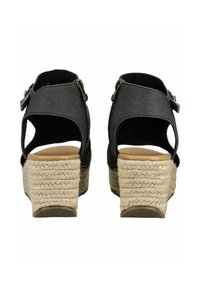 Black espadrille wedge sandals with a textured fabric upper, adjustable buckles, and woven rope heels. Open back design, tan insoles.