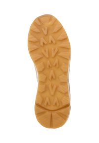 Rubber shoe sole with a textured pattern featuring multi-directional lugs in beige, designed for grip and traction on various surfaces.