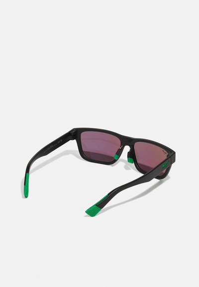 Sunglasses with black frames, green rubber accents on the temple tips, and gradient purple lenses; square design with a sporty profile.