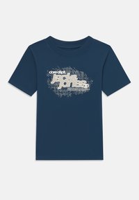 Marineblå bomull T-skjorte med korte ermer, med grafisk trykk i hvitt med bølgemønster og tekst. Rund hals design.