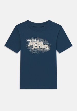 Navy cotton T-shirt with short sleeves featuring a graphic print in white with wavy lines and text. Crew neck design.