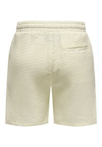 Weiße strukturierte Shorts mit einem Karomuster, elastischem Taillenbund und einer einzigen Gesäßtasche. Hergestellt aus atmungsaktivem Stoff für zusätzlichen Komfort.