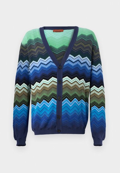 Multicolored zigzag patterned cardigan. Made of knit fabric, features a navy blue V-neck, button closure, and ribbed cuffs.
