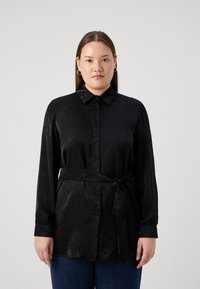 Black long-sleeve shirt made of smooth fabric, featuring a button-up front and a tied belt at the waist, with a classic collar and cuffs.