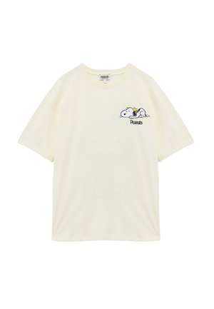 Cremfarbener Baumwoll-T-Shirt mit kurzen Ärmeln, das ein gesticktes Snoopy-Design mit einer Musiknote und dem Text "Peanuts" zeigt, klassischer Rundhalsausschnitt.