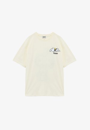 Cream cotton short-sleeve t-shirt featuring an embroidered Snoopy design with a music note and "Peanuts" text, classic crew neckline.