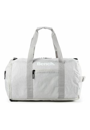 Sac polochon Bench gris clair avec poche avant en mesh, double poignées et compartiments zippés, présenté sur fond blanc.