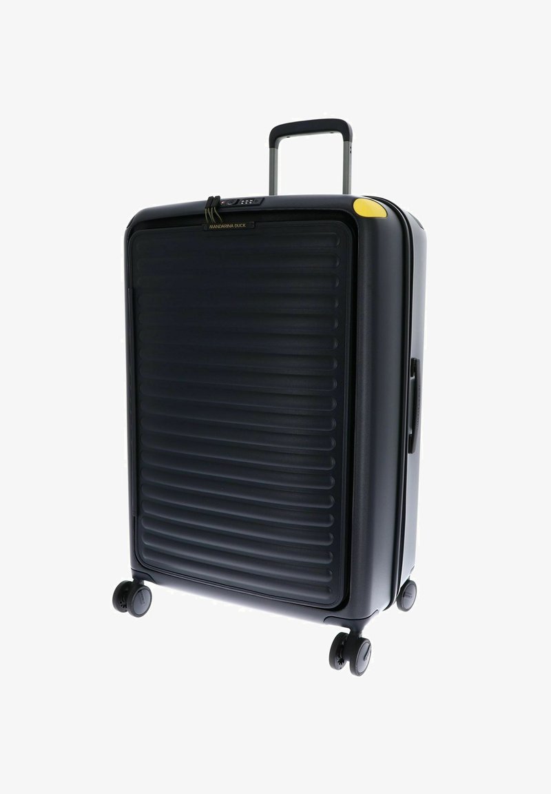 Valise rigide noire avec texture nervurée, dotée d'une poignée rétractable, de 4 roues et d'un accent jaune près de la fermeture éclair.