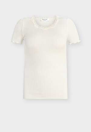 Valge soonikkoes lühikeste varrukatega topp pitsäärisega ruudukujulise kaelusega ja kerge volanguga mansettidel, suurus väike.