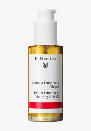 Huile corporelle revitalisante Dr. Hauschka Lemon Lemongrass en flacon transparent avec pompe blanche et bande d’étiquette rouge.