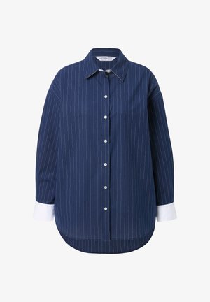 Laivastonsininen napillinen paita, jossa pystysuorat valkoiset raidat, leveä kaulus ja valkoiset kontrastihihansuut. Valmistettu sileästä kankaasta ja siinä on rento istuvuus.