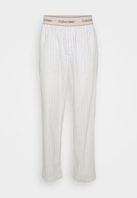 Witte gestreepte pyjamabroek met een elastische Calvin Klein tailleband. Voorzien van verticale blauwe strepen, rechte snit en zachte stoftextuur.