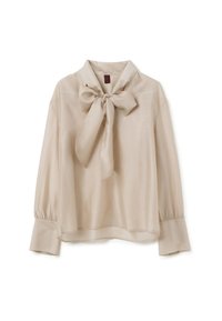Blouse beige en tissu lisse, dotée d'un grand col nœud, de manches longues avec des poignets froncés, et d'une coupe décontractée.