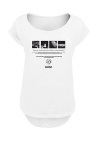 White t-shirt with a scoop neckline and short sleeves. Features NASA logo and graphic prints of space imagery, with text in bold black.