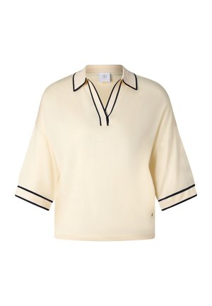 Kremfarvet kortærmet striktop med sort kant på krave, halsudskæring og manchetter, med afslappet pasform og åben V-udskæring.