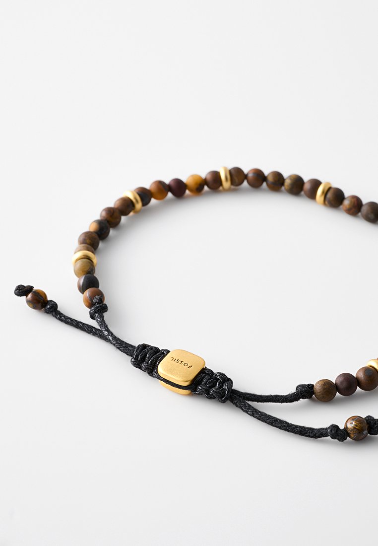 Bracelet en perles composé de perles en bois foncé, d'accents dorés et d'un cordon noir réglable avec un fermoir carré doré gravé de texte.