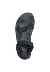 Black sandal with a textured sole, featuring adjustable nylon straps for secure fit. Flat, open design suitable for casual wear.