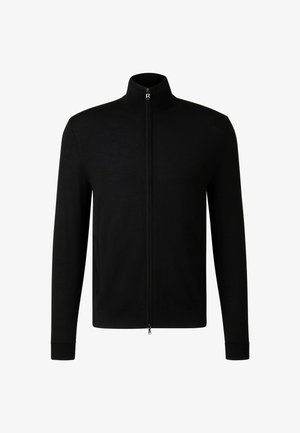 Black zip-up jacket with a high collar, made of smooth fabric. Features side pockets and fitted long sleeves. Minimalist design with no patterns.