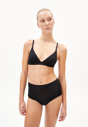 Schwarzer Bralette mit V-Ausschnitt und dünnen Trägern, kombiniert mit hochgeschnittenem schwarzen Unterwäsche, aus glattem Stoff und mit minimalistischem Design.