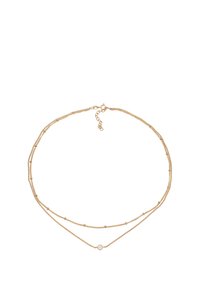 Goudkleurige gelaagde ketting met twee strengen, waarvan één met kralen en de andere met een centrale ronde accent. Verstelbare kettingsluiting.