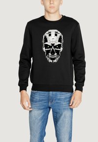 Sudadera negra con un diseño central de calavera en blanco y verde, confeccionada en una tela suave con puños y dobladillo acanalados.