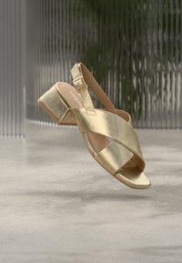 Επιλέχθηκε, gold-coloured