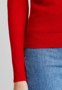 United Colors of Benetton Stickad tröja - red