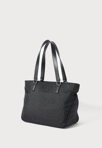 Black textured tote bag with double shoulder straps and a zippered top, shown against a plain light background.