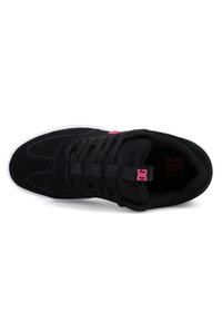 Black sneaker with thick laces, pink logo on tongue and side, padded collar, and white sole shown from top view on white background.