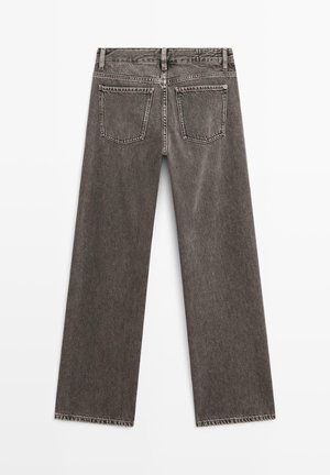 Jeans grigi a gamba dritta con vita alta, dotati di cinque tasche e orli sfrangiati. Realizzati in denim con una finitura strutturata.