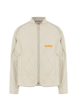 Light beige quilted bomber jacket with a ribbed collar, front zipper, side pockets, grey accenting, and orange "GUESS" logo on the chest.