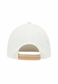 White cap with a curved brim, featuring a smooth texture and a patterned beige strap on the back, designed with a modern aesthetic.