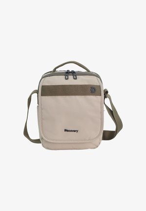Compact beige crossbody bag with green strap, top handle, dual zipper, front pocket, and "Discovery" brand logo on front.