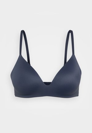 Tengerészkék, varrat nélküli bralette, háromszög alakban, állítható pántokkal és sima textúrával. Nincs látható párnázás vagy díszítés.