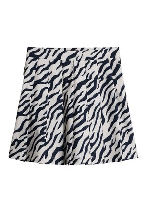 Gonna mini plissettata in tessuto bianco caratterizzata da un motivo a strisce zebrate blu navy. Include una vita e una chiusura con zip laterale.