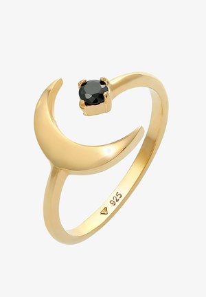 Bague couleur or en forme de croissant, dotée d'une pierre noire sertie dans un sertissage à griffes. Marquée "925" pour indiquer le contenu en argent sterling.