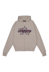 Zip-up hoodie in light beige, cotton blend. Features a graphic print of stars and text in pink and black on the front. Kangaroo pockets.