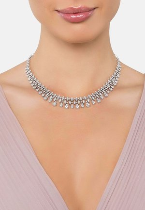 Silver-tone necklace featuring a symmetrical design with pear-shaped clear crystals arranged in a graduated pattern.