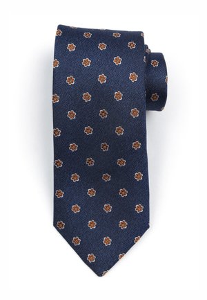 Donkerblauwe stropdas met een gestructureerde stof, voorzien van een klein bloemmotief in bruin en crème. Gevormd met een puntige tip en netjes opgerold.