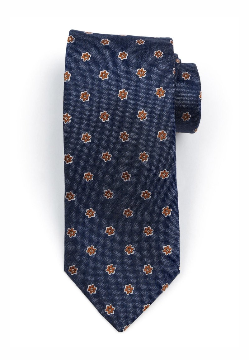 Donkerblauwe stropdas met een gestructureerde stof, voorzien van een klein bloemmotief in bruin en crème. Gevormd met een puntige tip en netjes opgerold.