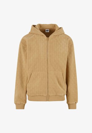 Zip-up hoodie in light tan color, featuring a textured pattern, front pockets, and a lined hood. Ribbed cuffs and hem for snug fit.