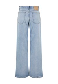 Lysvaskede vid bukser med høj talje, baglommer og minimale syninger. Fremstillet af denimstof.