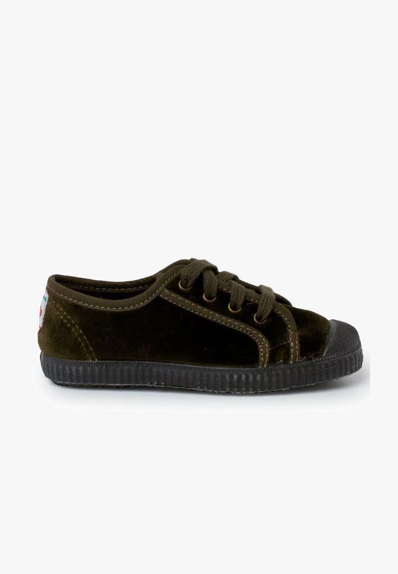 Dark green velvet shoe with rubber sole, rounded toe, lace-up design, and contrasting stitching. Accented with a colored label on the heel.