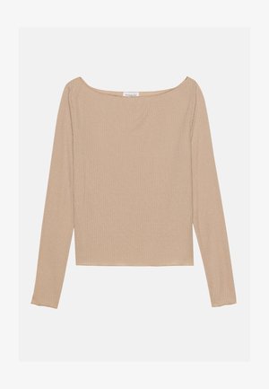 Langermet ribbestrikket topp i lys beige, med bred båndhals og tettsittende fasong. Myk tekstur med subtil stretch.