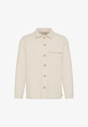 Beige strukturierte Hemdjacke mit Kragen, einer einzelnen Brusttasche und fünf kontrastierenden Knöpfen entlang der Vorderseite. Weicher Stoff.