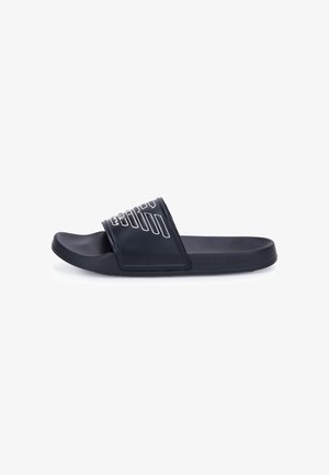 Sandalo slip-on nero con ampia fascia caratterizzata da un motivo geometrico bianco, sottopiede sagomato e suola texturizzata, mostrato su sfondo bianco.