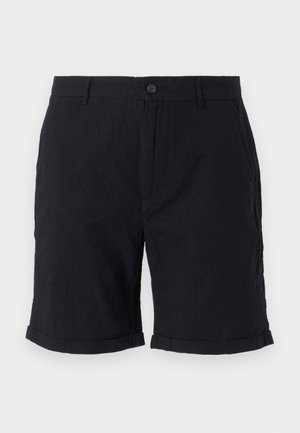 Shorts en lin noirs avec fermeture à bouton, présentant des ourlets retroussés et des poches latérales, offrant une finition texturée et un design décontracté.