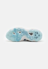 Shoe sole with a wavy, textured design in light blue and white. Features different patterns, including circular and zigzag elements.