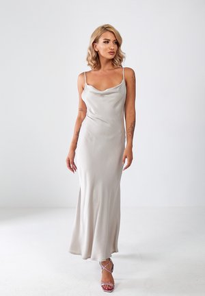 Satin slip dress in light gray, featuring thin straps and a cowl neckline. The skirt flows to the floor with a slight flare.
